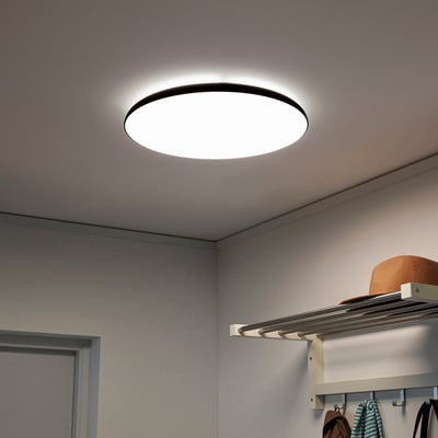 NYMÅNE ceiling light, white, round, sleek, well-lit space with hat storage.