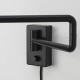 Black modern wall-mounted lamp with adjustable metal arm and knobs.