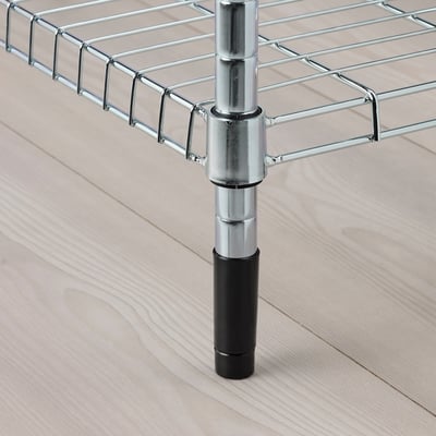 Metal shelf with adjustable, heighten feet for stability, shown on wooden floor.