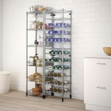 Chrome OMAR shelving with adjustable tiers for kitchen items. Sturdy steel, between cabinets and tiles.