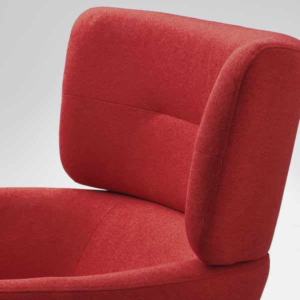 Bright red sofa chair, soft and inviting, high back and armrests, excellent comfort.
