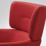 Bright red sofa chair, soft and inviting, high back and armrests, excellent comfort.