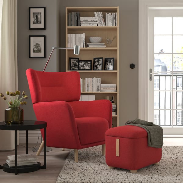 Red OSKARSHAMN wing chair & stool: cozy, high-back design; perfect for reading nook.