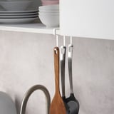 Kitchen hooks holding utensils; part of PÅLYCKE series.