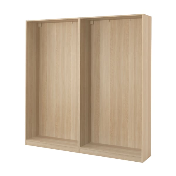 An ikea PAX wardrobe frame in light oak veneer. Its rectangular, with a minimalist and modern design, ideal for space-efficient storage.