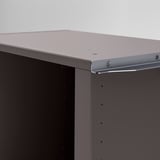 Modern corner wardrobe detail: sleek metallic finish, precise screws, quality build.