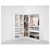 A modern, white PAX wardrobe corner unit showcasing organized clothes, shelves, and drawers, illustrating versatile storage solutions.