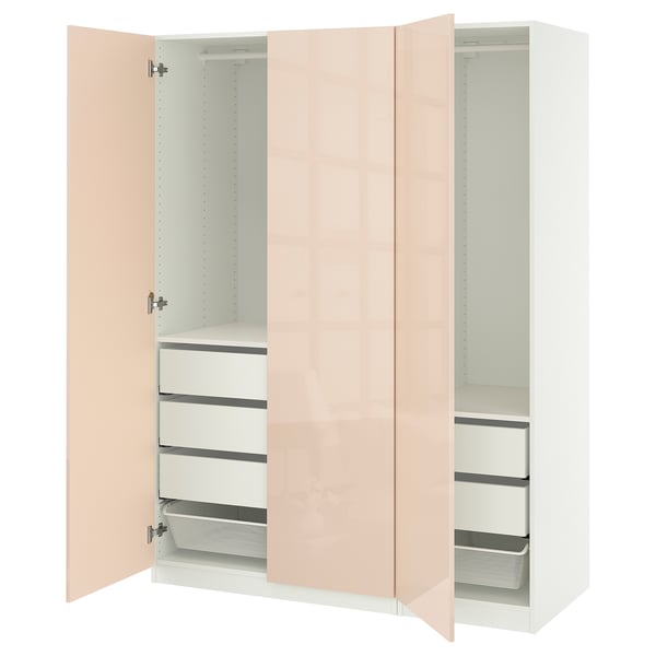 An open white ikea PAX wardrobe with pink doors, featuring shelves and drawers.