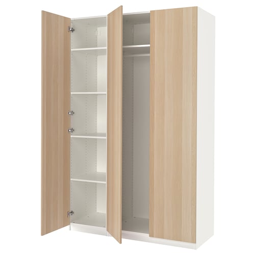 An open white and light wood PAX wardrobe with multiple shelves inside.