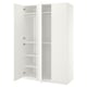 Displays an open white ikea PAX wardrobe with empty shelves and a hanging rail.