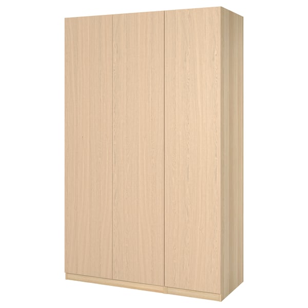 Light-colored wood PAX wardrobe with simple, minimalist design; rectangular, smooth doors.
