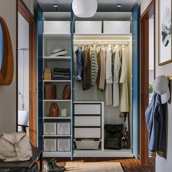 A neatly organized closet displaying clothes on hangers, folded items on shelves, and drawers below, showcasing versatile storage solutions.