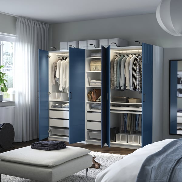 Modern blue wardrobe with mirrors, adjustable shelves, and integrated lighting.