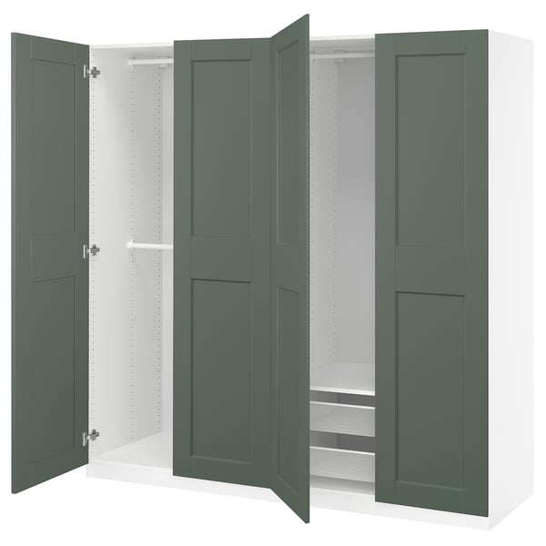 Green PAX wardrobe with open doors showing shelves. Contemporary design with clean lines.