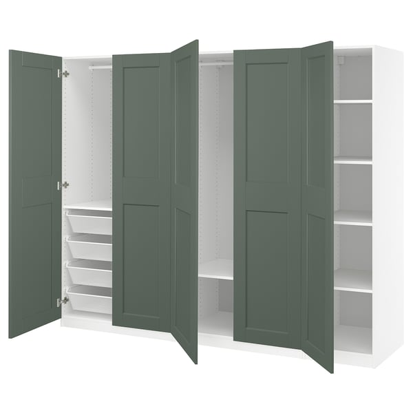 An open PAX wardrobe in green with shelves and organizers.