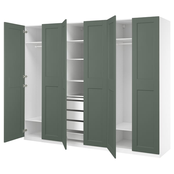 PAX wardrobe in green with multiple compartments and shelves.
