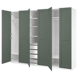 PAX wardrobe in green with multiple compartments and shelves.