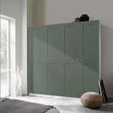 Teal PAX wardrobe by window, tall, next to bed.