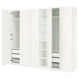 White PAX wardrobe with open doors, shelves, and drawers. Modern, minimalist design for organized storage.