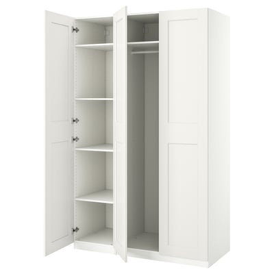 White PAX wardrobe, open, tall with multiple shelves and hanging rail, white interior, modern minimalist design.