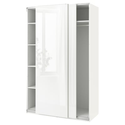 A white ikea PAX wardrobe with sliding doors and open shelves. The wardrobe is rectangular and minimalistic, blending seamlessly into modern decor.