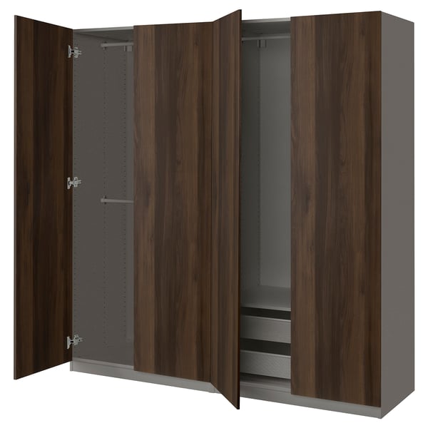 Wooden PAX wardrobe, dark brown, open doors exposing closet space with shelves and hanging bar.