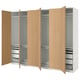 An open ikea PAX wardrobe in white and light wood. It shelves, drawers, and hanging space.