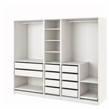 A white IKEA PAX wardrobe system, featuring shelves, drawers, and hanging space.