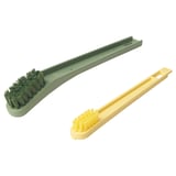 Two colorful shoe brushes: green and yellow. Slim, elongated handles with bristles for cleaning shoes.