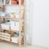 Shelf with storage bins and containers, some with visible contents, organized for easy access.