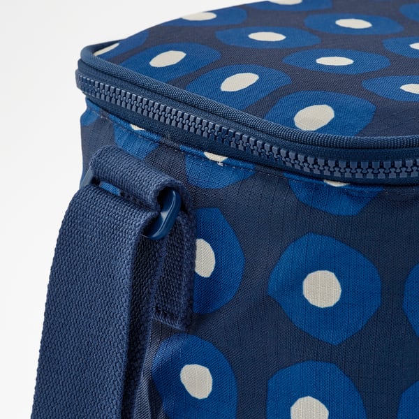 Close-up of recycled polyester cooler bag with blue polka dots and sturdy zipper.