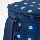 Close-up of recycled polyester cooler bag with blue polka dots and sturdy zipper.