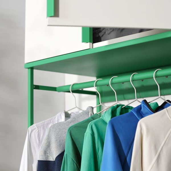 Colorful storage shelf with clothes hanger.