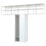White ikea PLATSA modular closet with open shelves and closed storage.