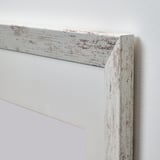 Whitewashed wooden picture frame with distressed texture. Close-up shows solid craftsmanship and detailed edge.