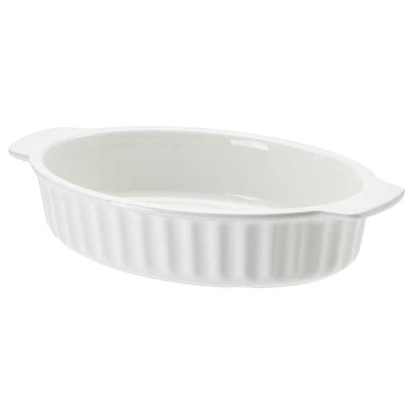 A white oval stoneware baking dish with ribbed design and handles. Ideal for cooking and serving.