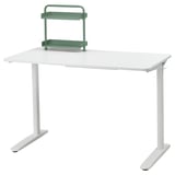 White RELATERA desk with adjustable green shelf for organization.