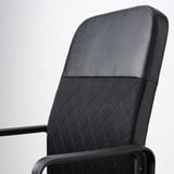 Close-up of ergonomic office chair, showcasing comfortable fabric backrest and sturdy armrest.