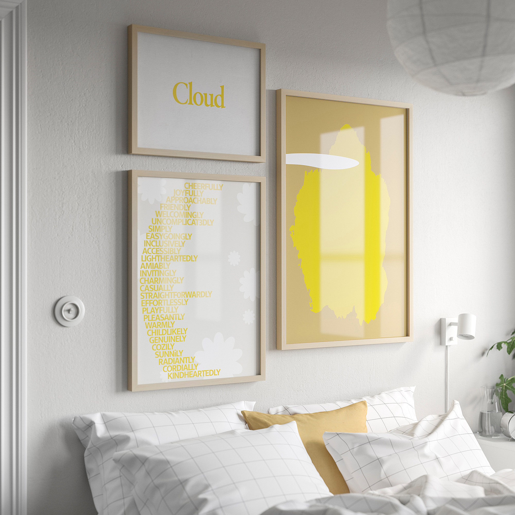 Three framed artworks above bed: cloud, adjectives, abstract in yellow. Clean, cheerful decor.