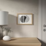 Minimalist living space with adaptable abstract art.