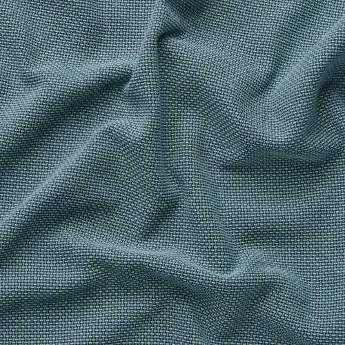 Close-up of a textured green woven blanket, showcasing its intricate, tight-knit pattern and soft, cosy appearance.