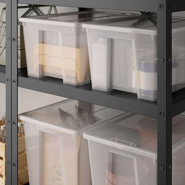 Black metal shelf with clear plastic boxes, largest at bottom.