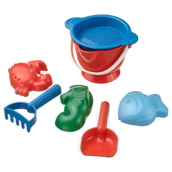 Bright beach toy set includes red crab, blue rake, green duck, blue fish, red shovel, and red/blue bucket with strainer. Fun for sand play.