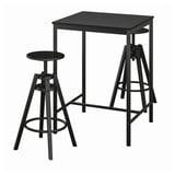 Black metal bar table and two stools. Modern, square top, adjustable height.