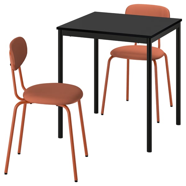 A sandberg dining set with a black table and two orange chairs, featuring a modern design with metal frames and upholstered seats for comfort.