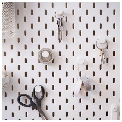 Multiple sets of white, round, interlocking hooks on a clear background.