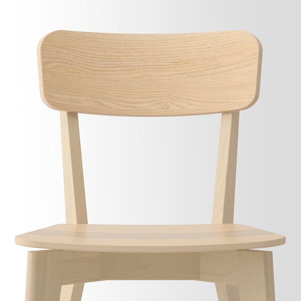 A sleek, light-colored wooden chair with smooth, rounded edges and a generously sized, curved backrest for comfort.