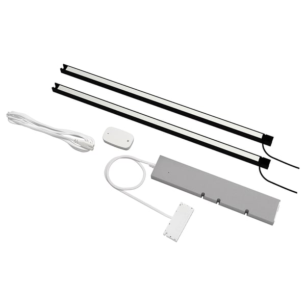 SKYDRAG led lighting set for enhet kitchen. Includes strips, sensor, dimmer, driver, and cords. Silver and white, modern design.