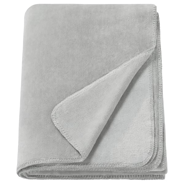 A folded light gray SLÅNGRÅMAL throw blanket made from soft, recycled polyester. It has a smooth, uniform design with stitched edges.