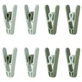 Eight green SLIBB clothespins arranged in two rows of four, featuring wide openings and robust design for hanging laundry.